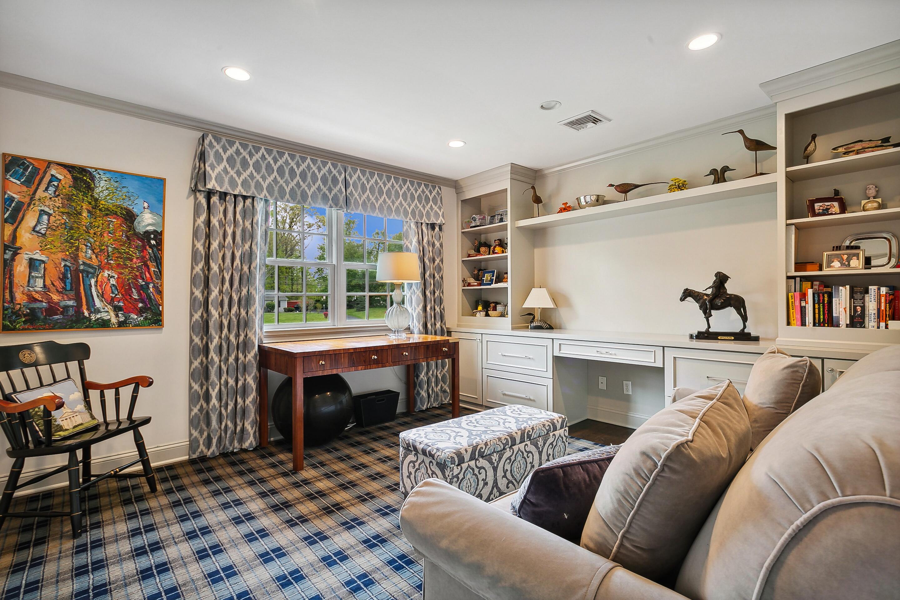 64 Summit Ridge Road New Canaan, CT 06840 - Photo 22 of 39 a living room with furniture and a fireplace