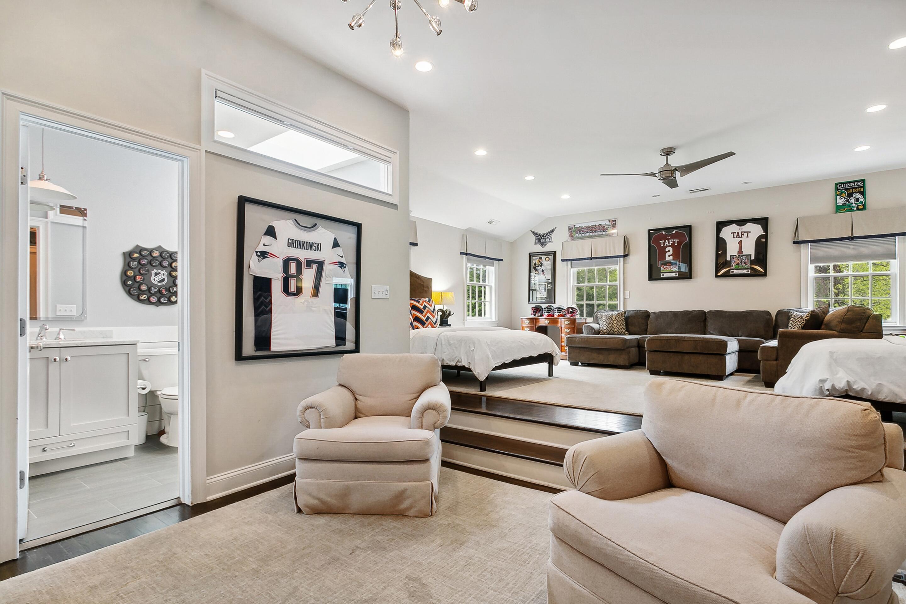 64 Summit Ridge Road New Canaan, CT 06840 - Photo 23 of 39 a living room with furniture and a ceiling fan