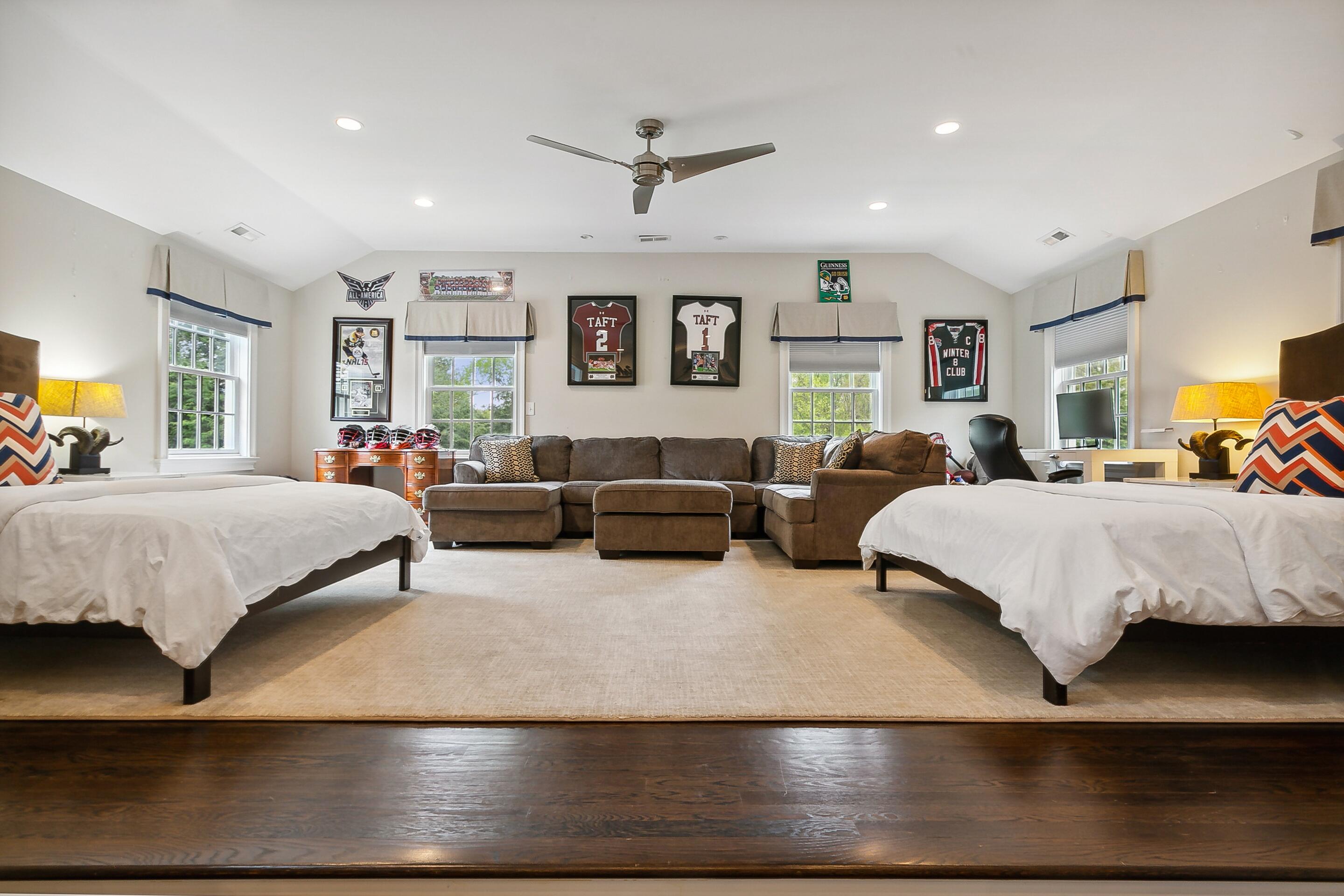 64 Summit Ridge Road New Canaan, CT 06840 - Photo 24 of 39 a bedroom with a large bed and a couch