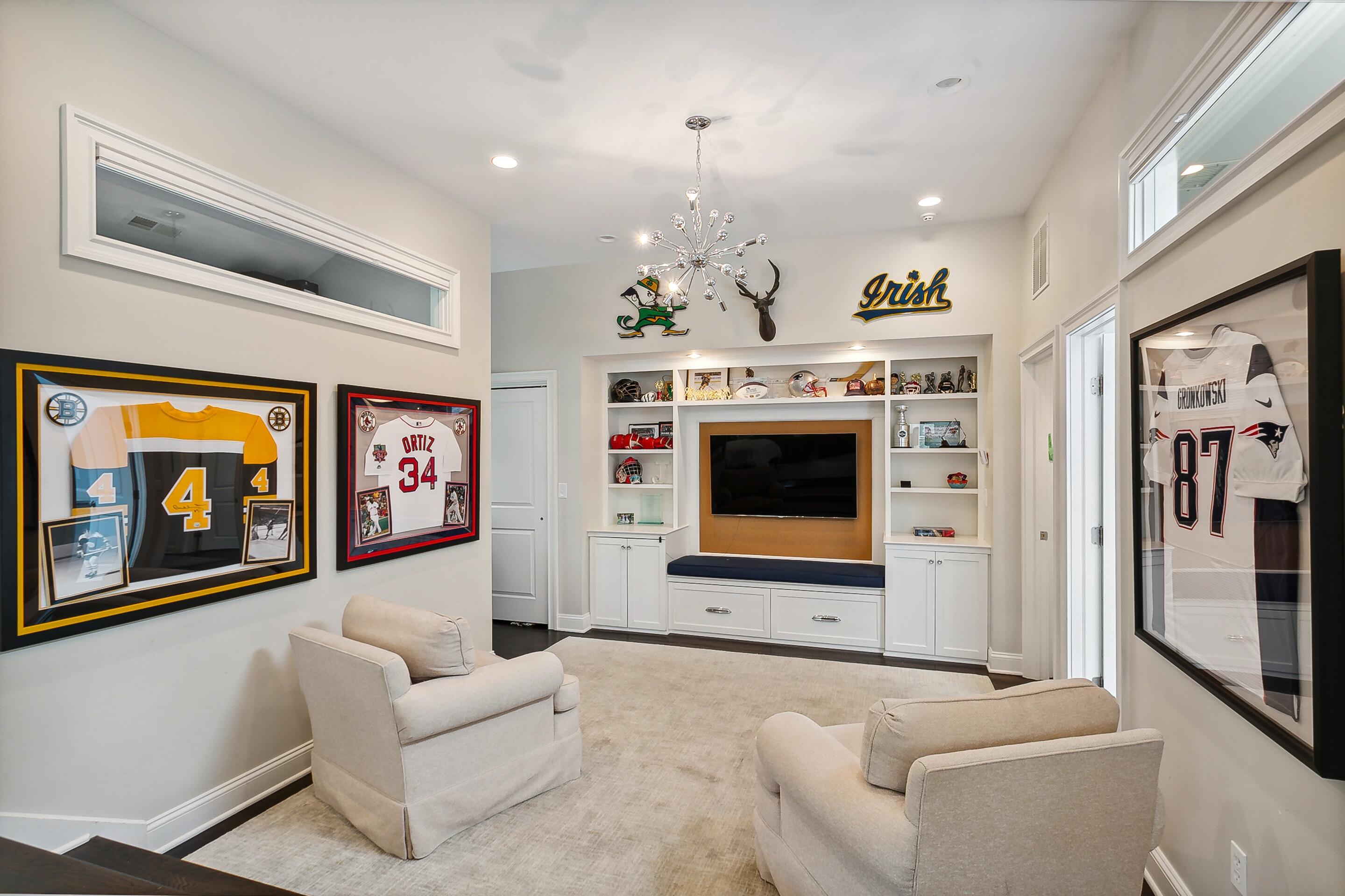 64 Summit Ridge Road New Canaan, CT 06840 - Photo 25 of 39 a living room with furniture and a flat screen tv