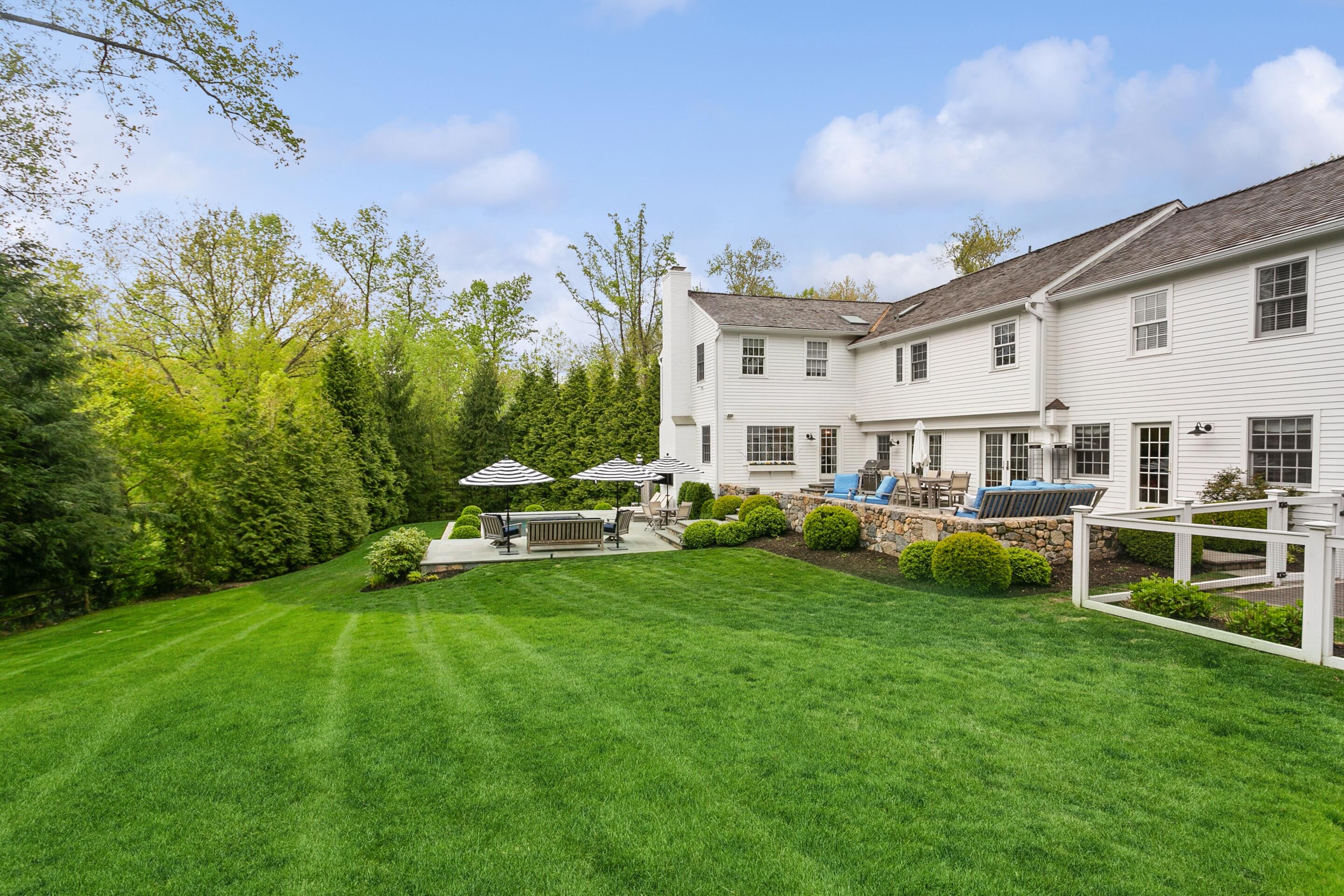 64 Summit Ridge Road New Canaan, CT 06840 - Photo 33 of 39 a view of a house with a yard porch and sitting area