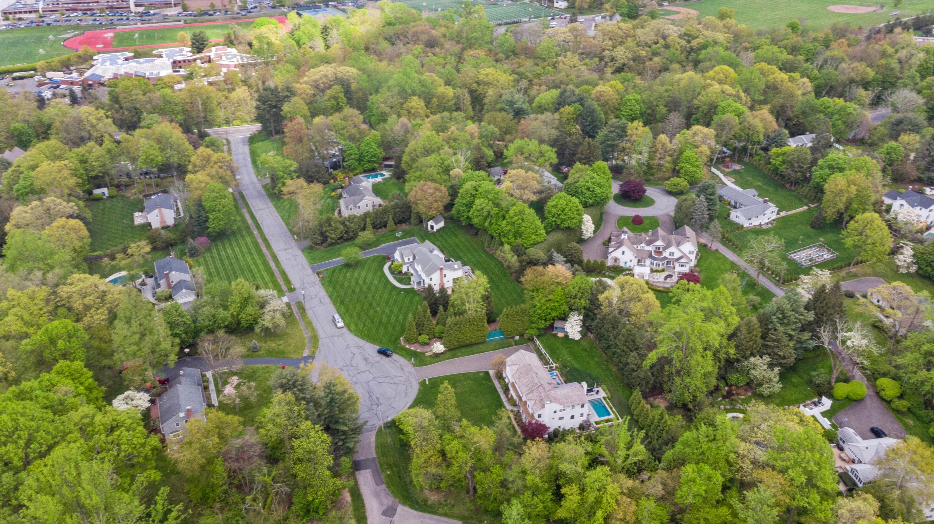 64 Summit Ridge Road New Canaan, CT 06840 - Photo 35 of 39 an aerial view of a house with a yard and garden