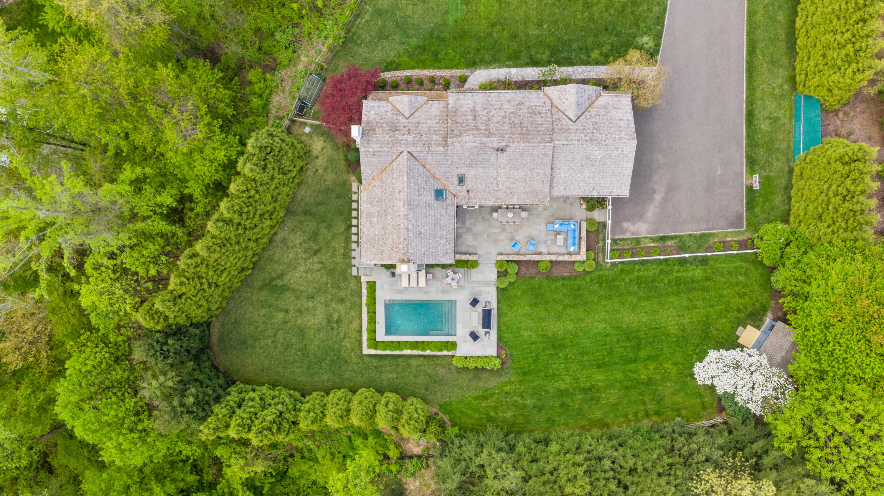 64 Summit Ridge Road New Canaan, CT 06840 - Photo 36 of 39 an aerial view of a house with a garden