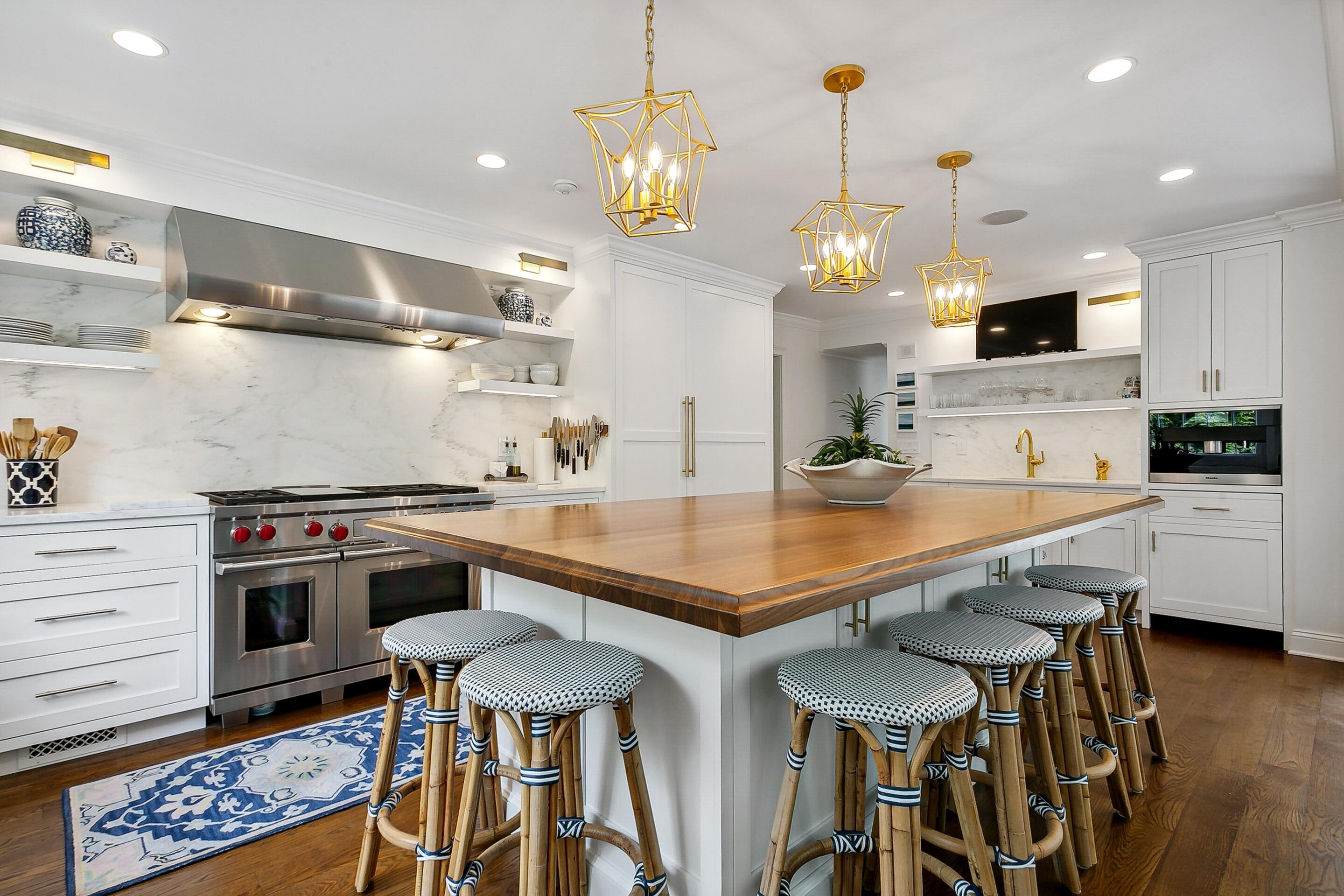 64 Summit Ridge Road New Canaan, CT 06840 - Photo 6 of 39 a kitchen with stainless steel appliances a table chairs in it and kitchen view