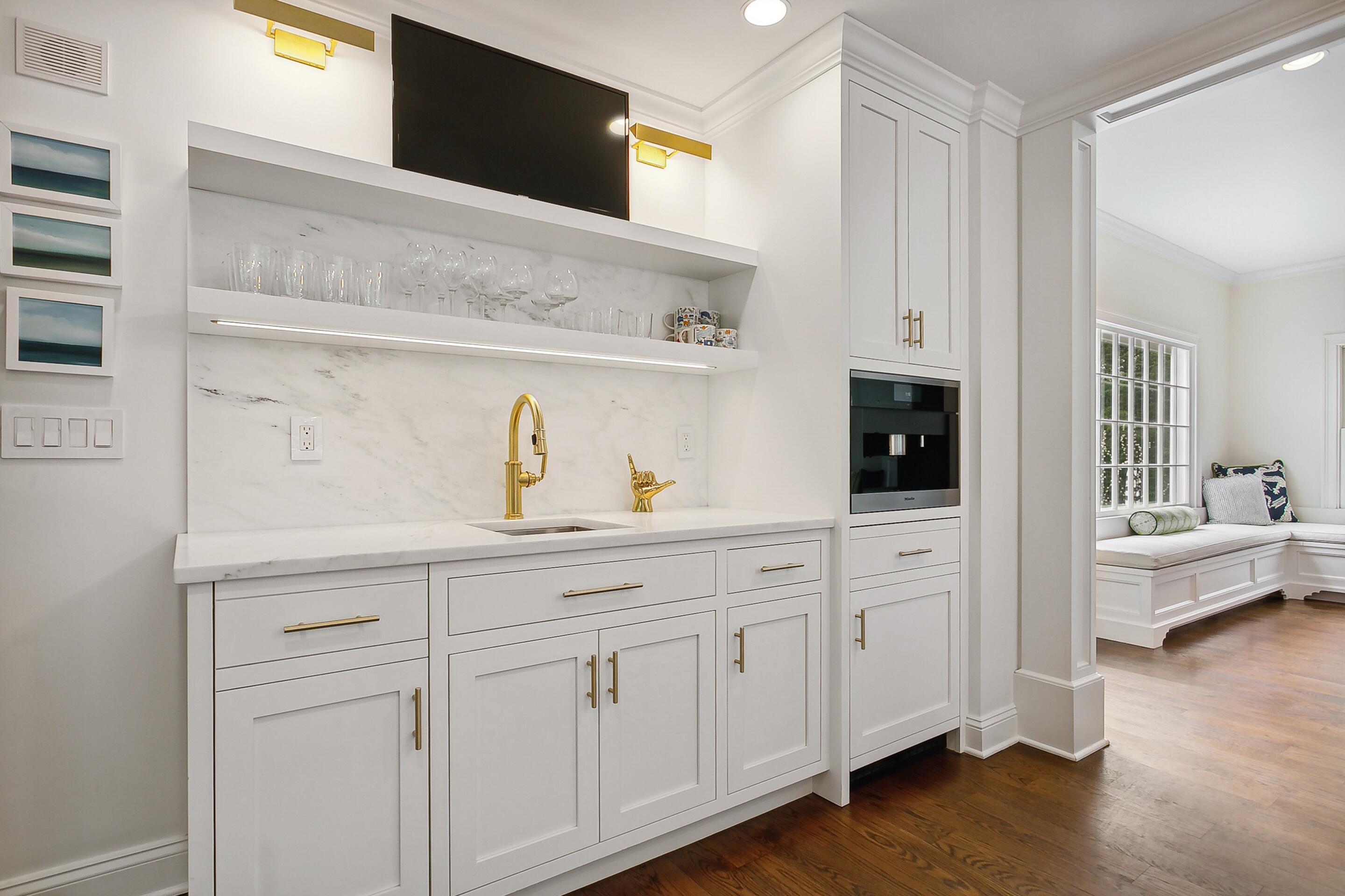 64 Summit Ridge Road New Canaan, CT 06840 - Photo 7 of 39 a kitchen with white cabinets and sink