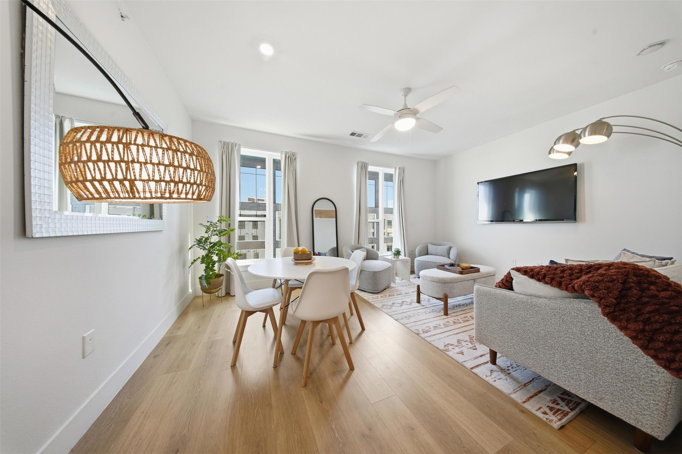 1701 Simond Avenue, Unit 615 Austin, TX 78723 - Photo 4 of 25 Open-concept living space with light wood-finish flooring, white walls, and recessed lighting