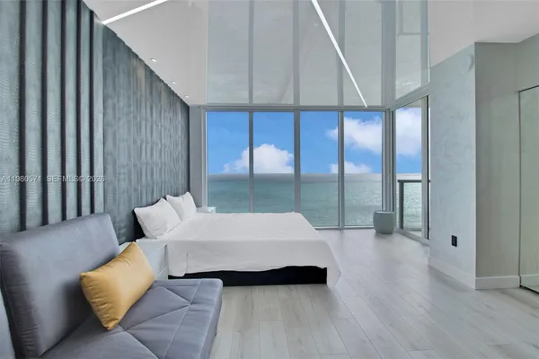 a bedroom with bed and a walk in closet