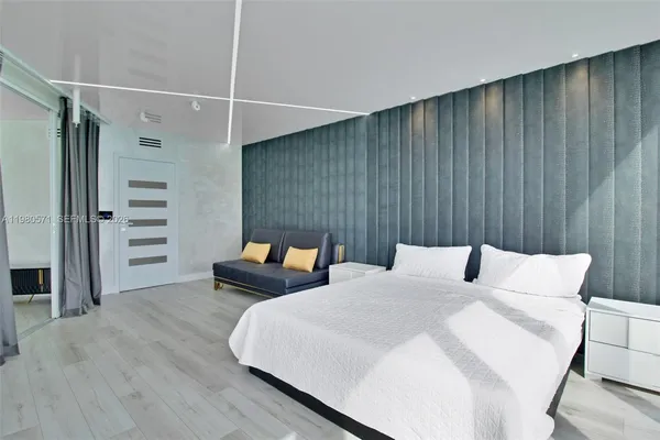 a view of an empty room with a bathroom