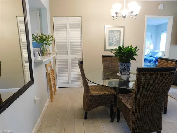 a view of a workspace with furniture and a potted plant