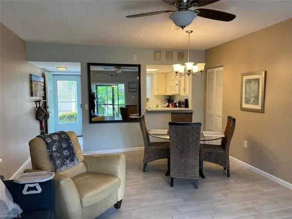 a dining room with furniture and window