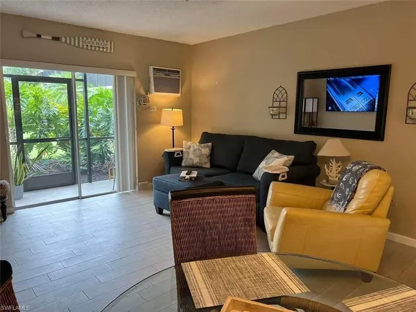 a living room with furniture and a window