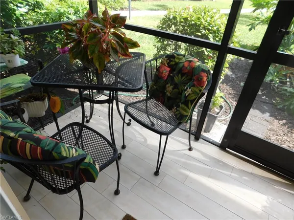 a view of balcony with wooden floor and outdoor seating