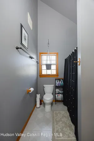 a bathroom with a toilet a sink and shower