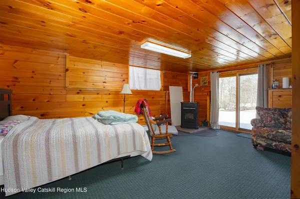 a bed sitting in a room next to a window