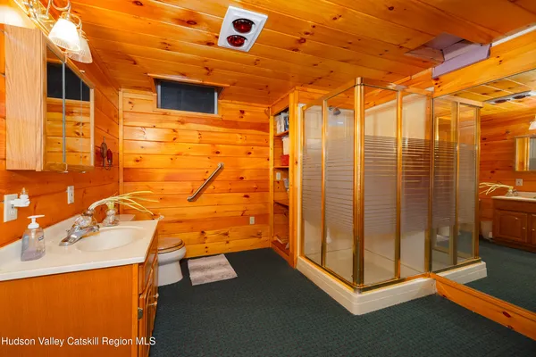 a bathroom with a shower and a sink