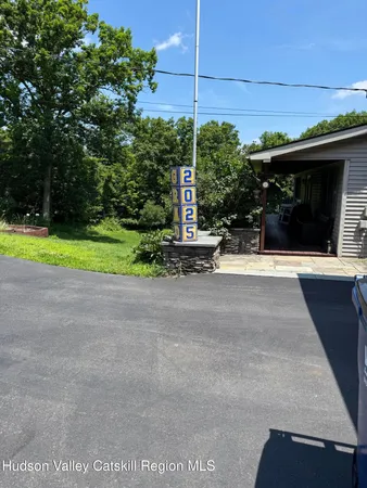 a view of house with yard