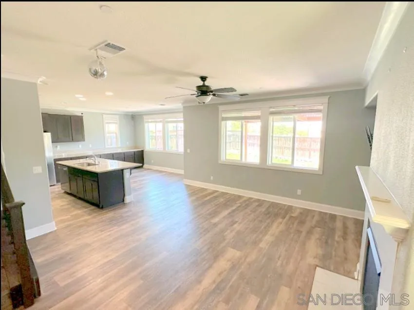 5311 Gramercy Circle Fairfield, CA 94533 - Photo 11 of 54 a large living room with stainless steel appliances granite countertop furniture and a fireplace
