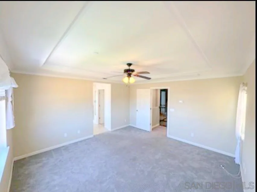 5311 Gramercy Circle Fairfield, CA 94533 - Photo 15 of 54 an empty room with chandelier fan and windows