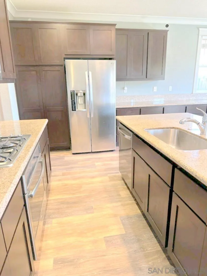 5311 Gramercy Circle Fairfield, CA 94533 - Photo 25 of 54 a kitchen with stainless steel appliances granite countertop a sink stove and refrigerator