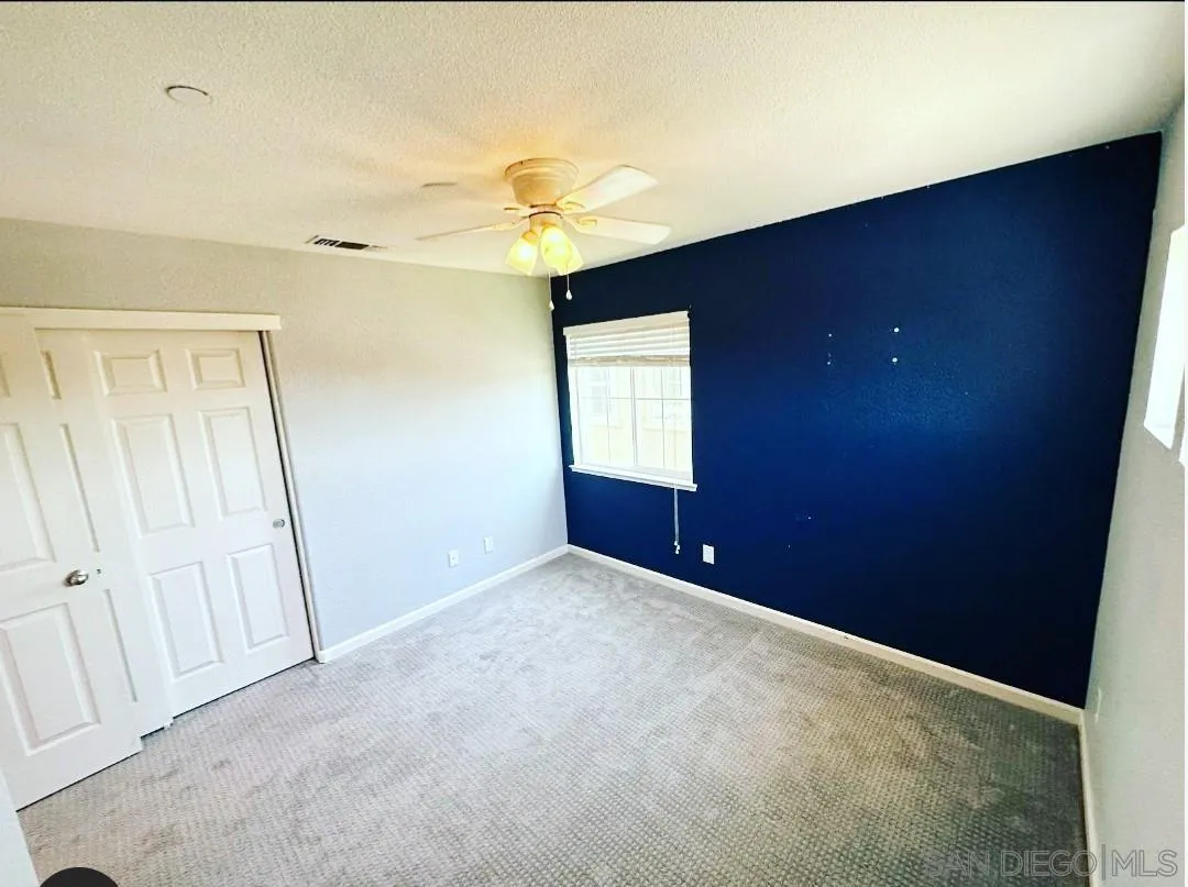 5311 Gramercy Circle Fairfield, CA 94533 - Photo 6 of 54 an empty room with a window and a ceiling fan