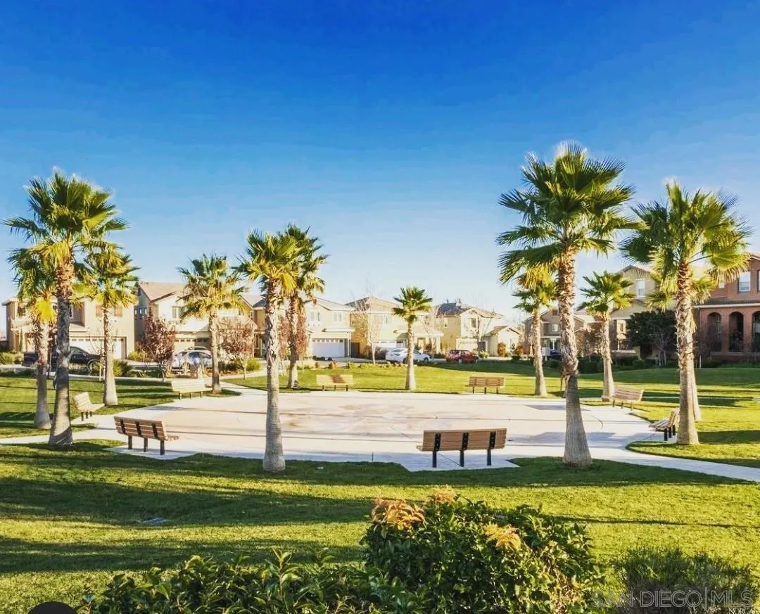 5311 Gramercy Circle Fairfield, CA 94533 - Photo 8 of 54 a view of a swimming pool with a lawn chairs and palm tree