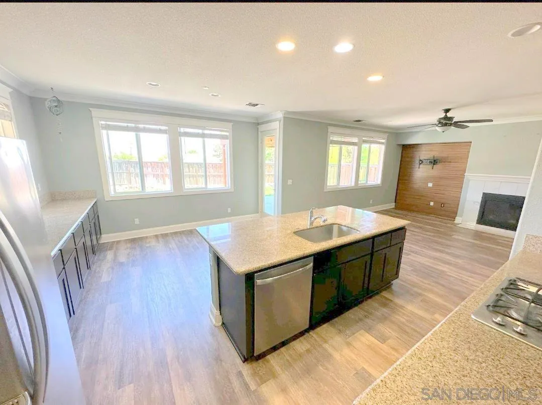 5311 Gramercy Circle Fairfield, CA 94533 - Photo 10 of 54 a living room with stainless steel appliances granite countertop furniture wooden floor and a window