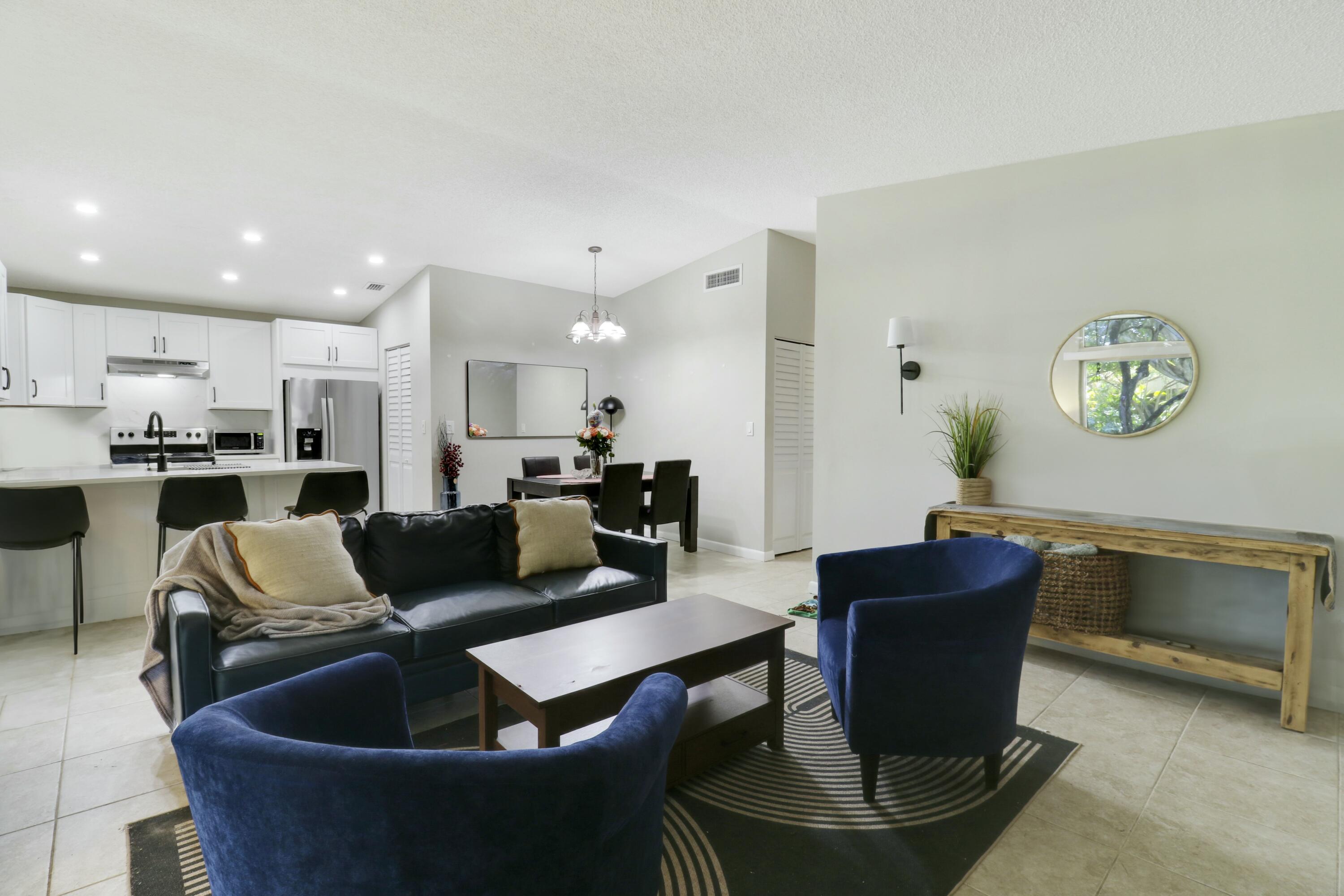 22274 Misty Woods Way Boca Raton, FL 33428 - Photo 35 of 42 Living-Dining-Kitchen