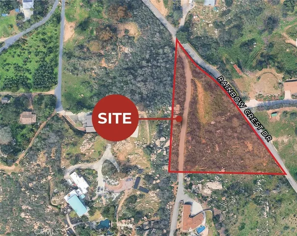 a view of a tree next to a yard