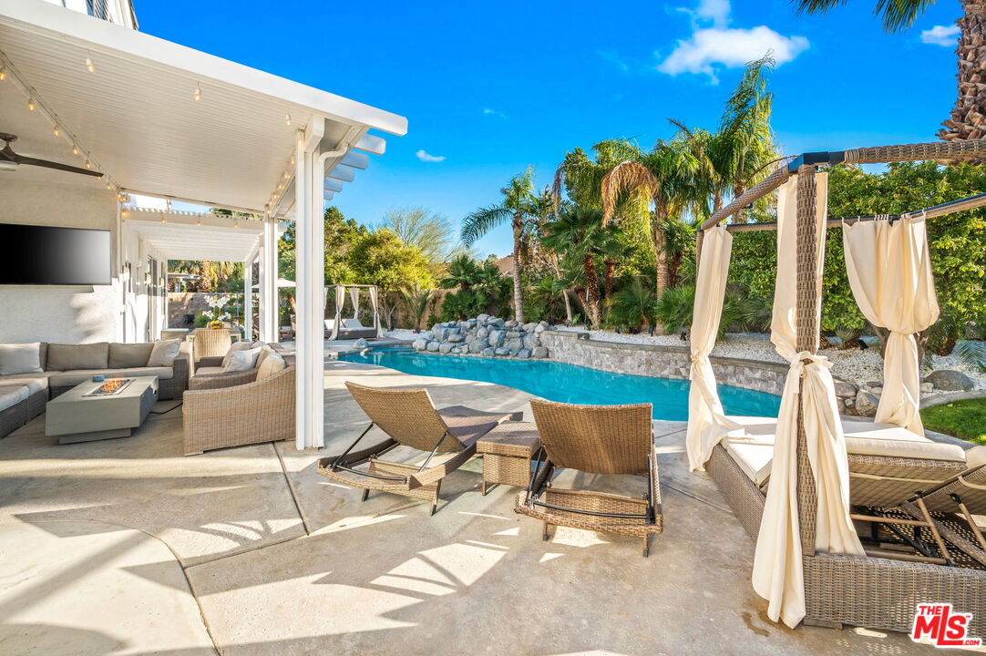 1083 East Circulo San Sorrento Road Palm Springs, CA 92262 - Photo 1 of 70 a building outdoor space with patio furniture and potted plants