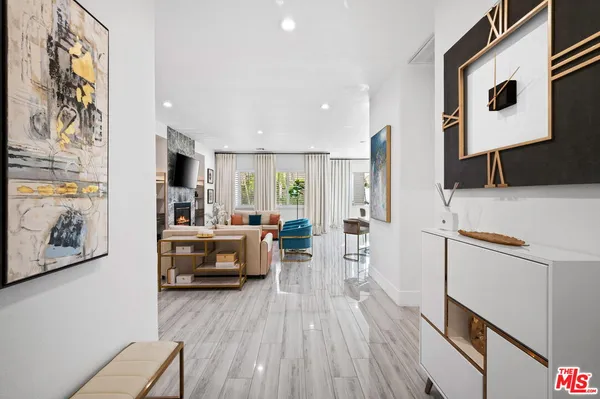 a kitchen with sink refrigerator and cabinets
