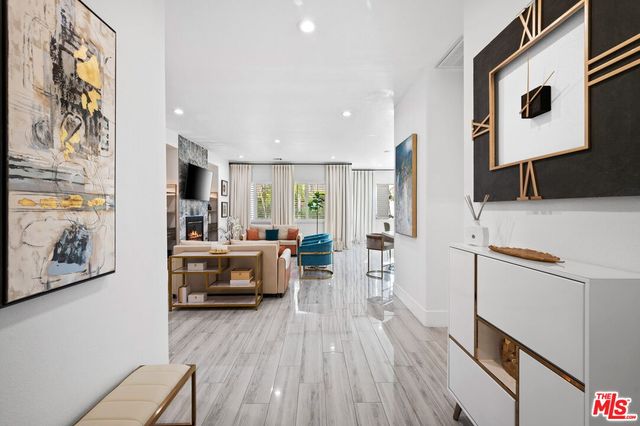 a kitchen with sink refrigerator and cabinets