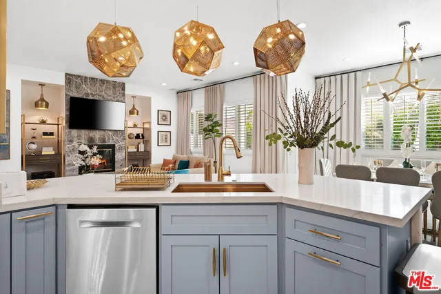 a stove top oven sitting inside of a kitchen