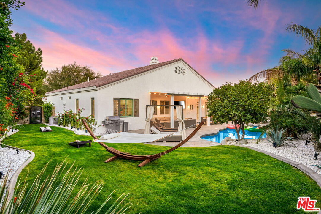 1083 East Circulo San Sorrento Road Palm Springs, CA 92262 - Photo 2 of 70 a view of a house with backyard and a slide