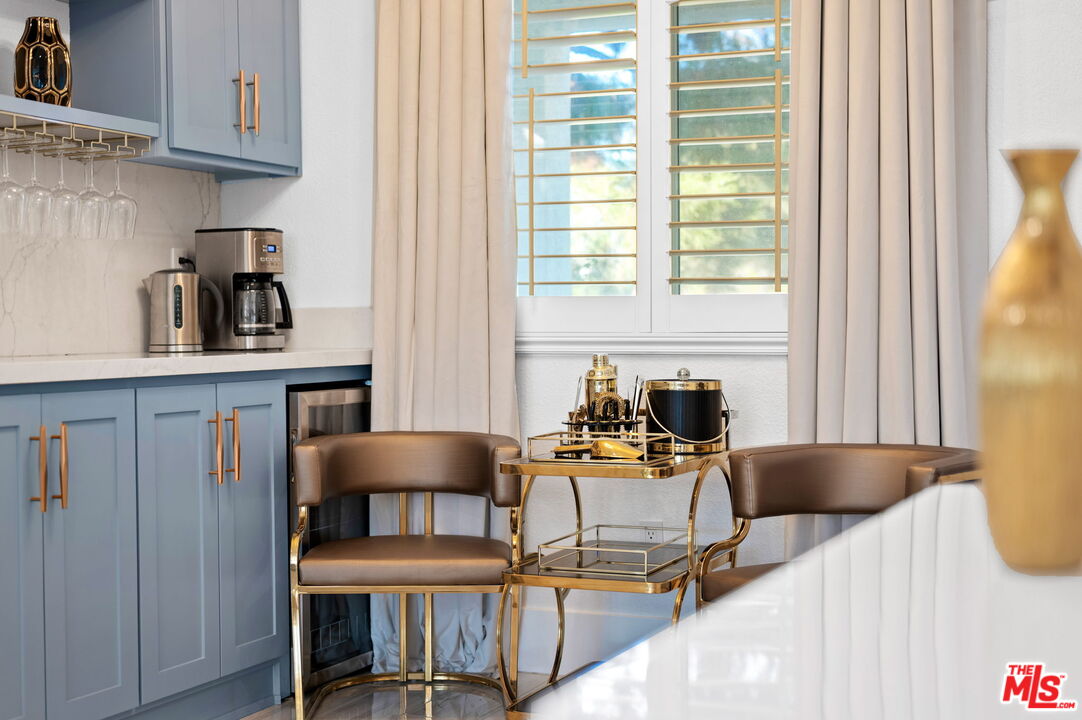 1083 East Circulo San Sorrento Road Palm Springs, CA 92262 - Photo 23 of 70 a view of a dining room with furniture and a window