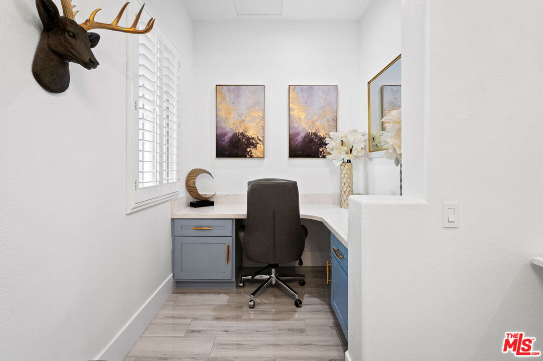 1083 East Circulo San Sorrento Road Palm Springs, CA 92262 - Photo 24 of 70 a view of workspace filled with furniture and windows