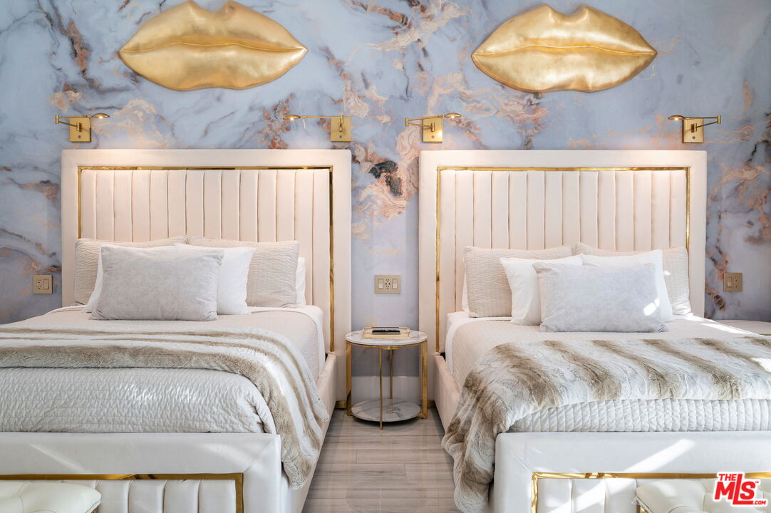 1083 East Circulo San Sorrento Road Palm Springs, CA 92262 - Photo 44 of 70 a bedroom with a bed and a painting on the wall