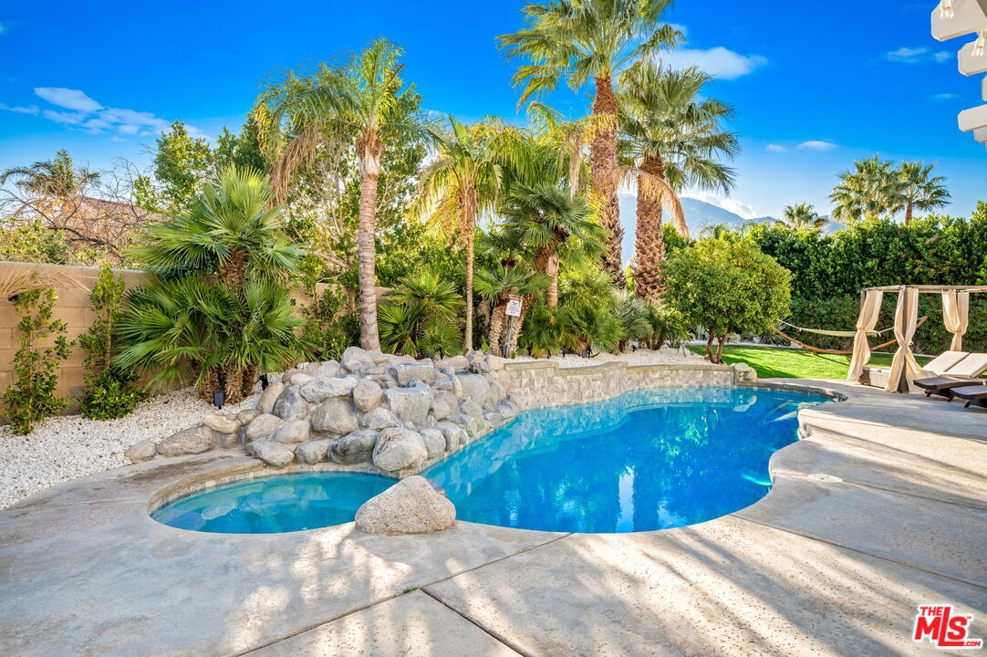 1083 East Circulo San Sorrento Road Palm Springs, CA 92262 - Photo 55 of 70 a view of a swimming pool with an outdoor space