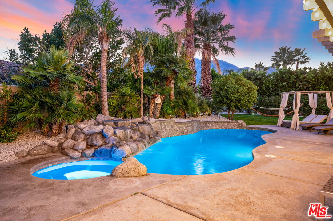 1083 East Circulo San Sorrento Road Palm Springs, CA 92262 - Photo 63 of 70 a view of a swimming pool with an outdoor space