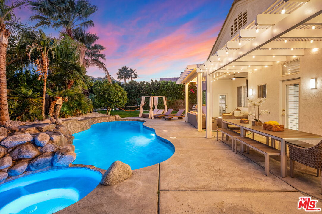 1083 East Circulo San Sorrento Road Palm Springs, CA 92262 - Photo 64 of 70 a view of a swimming pool with outdoor seating