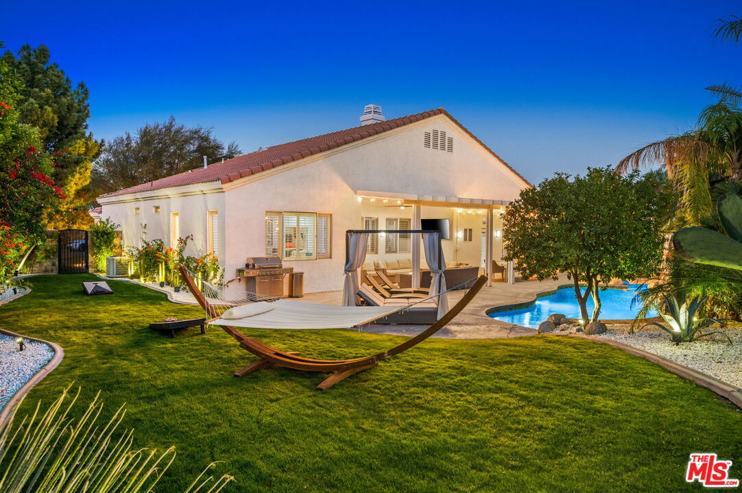 1083 East Circulo San Sorrento Road Palm Springs, CA 92262 - Photo 66 of 70 a view of a house with backyard and sitting area
