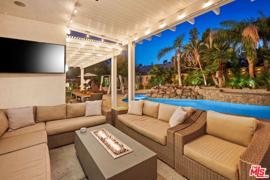 1083 East Circulo San Sorrento Road Palm Springs, CA 92262 - Photo 68 of 70 a living room with furniture and a flat screen tv