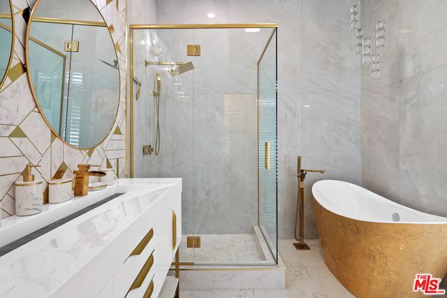 a living room with furniture a wooden floor and next to a window