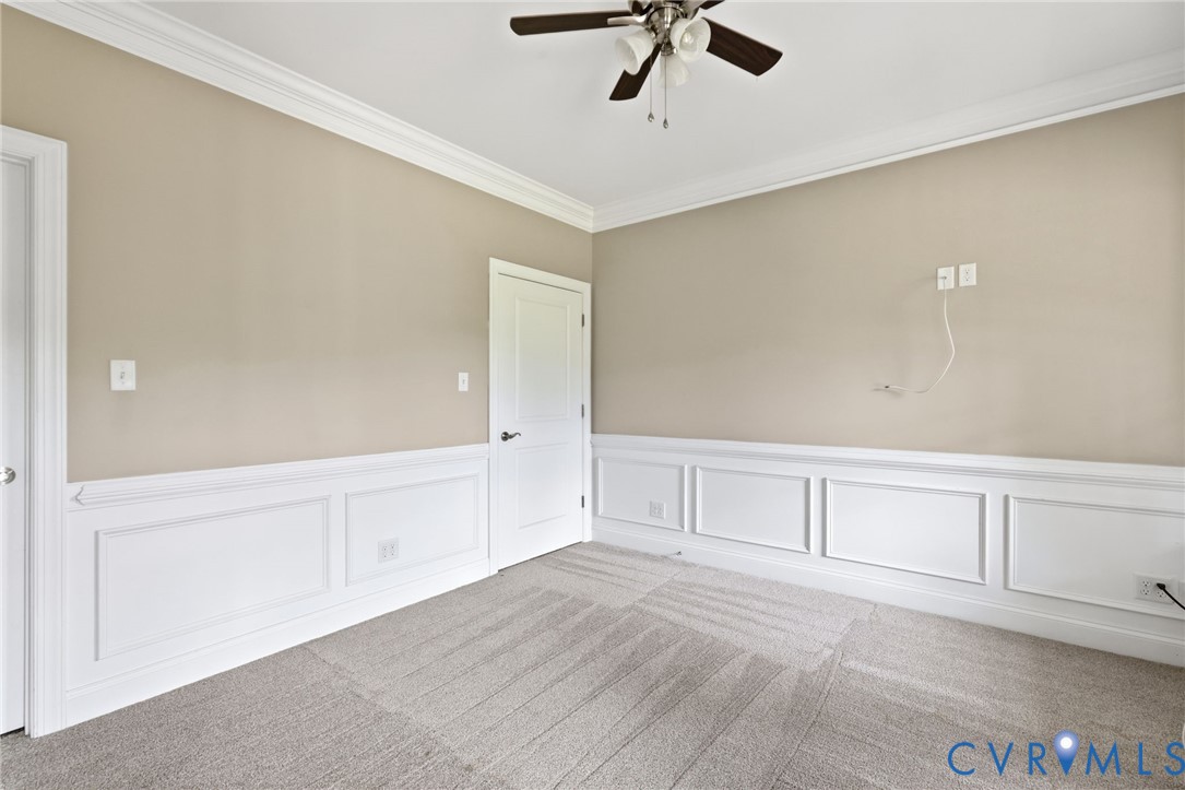 15220 River Road Chesterfield, VA 23838 - Photo 9 of 65 Neutral-toned walls featuring extensive crown mold