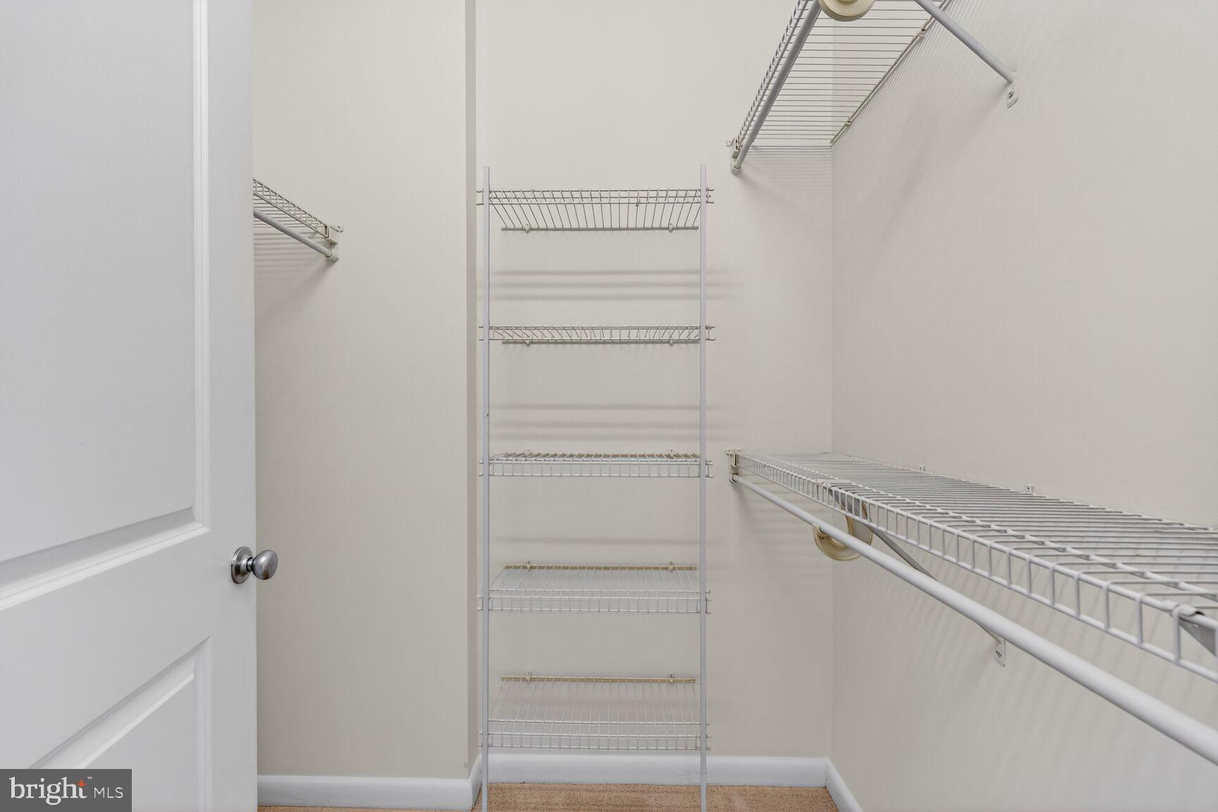 851 North Glebe Road, Unit 817 Arlington, VA 22203 - Photo 12 of 29 a view of walk in closet with empty racks