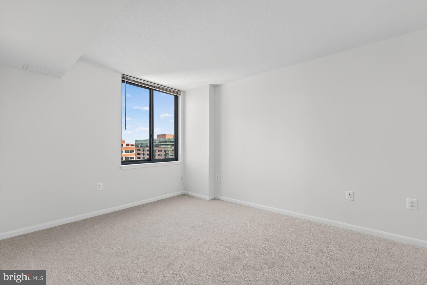 851 North Glebe Road, Unit 817 Arlington, VA 22203 - Photo 14 of 29 an empty room with windows