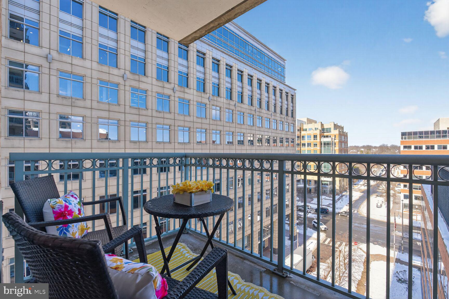 851 North Glebe Road, Unit 817 Arlington, VA 22203 - Photo 19 of 29 a view of a balcony dining area with chairs