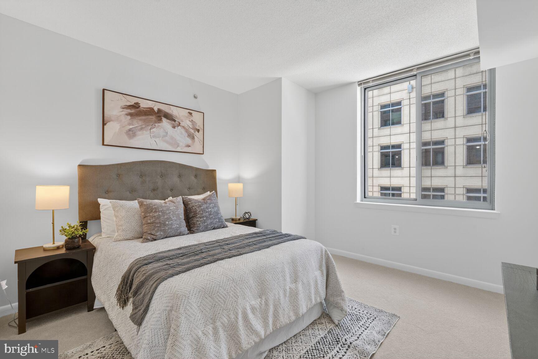 851 North Glebe Road, Unit 817 Arlington, VA 22203 - Photo 10 of 29 a bedroom with a bed and a window