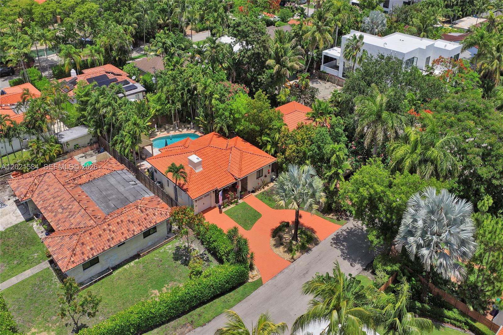 811 Northeast 73rd Street Miami, FL 33138 - Photo 41 of 51 an aerial view of a house with swimming pool and outdoor seating