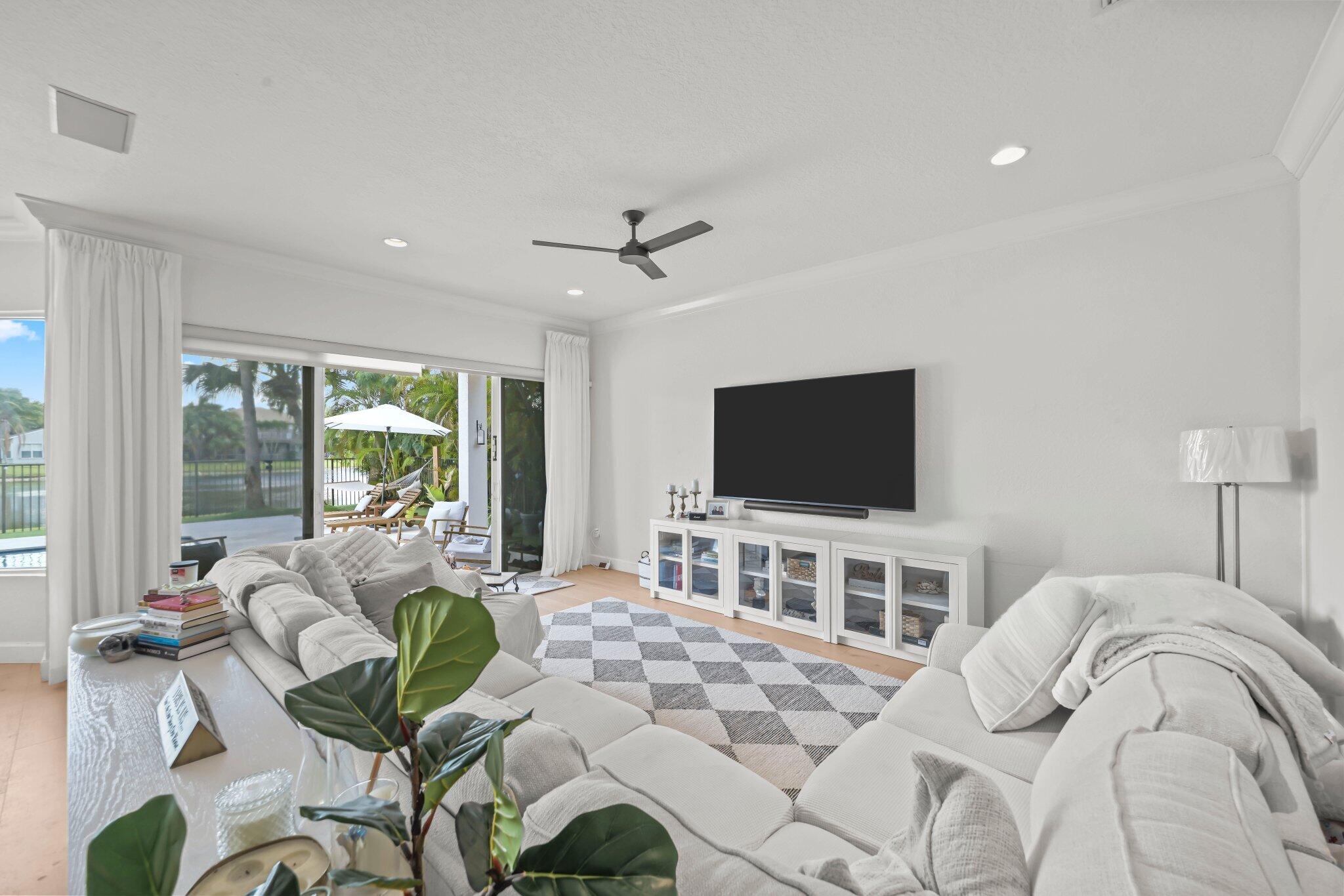 19650 Estuary Drive Boca Raton, FL 33498 - Photo 27 of 83 a bedroom with a bed and a flat screen tv