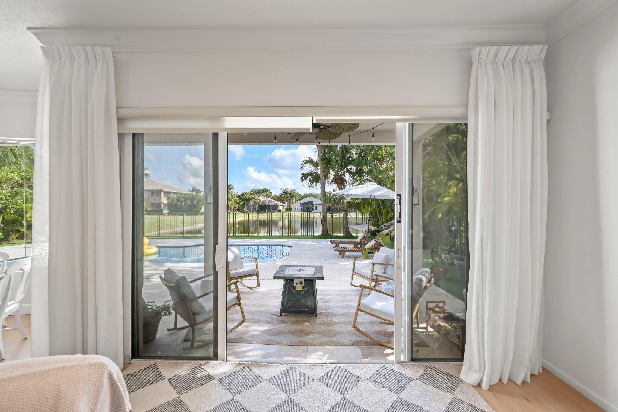 19650 Estuary Drive Boca Raton, FL 33498 - Photo 30 of 83 a living room with furniture and a large window